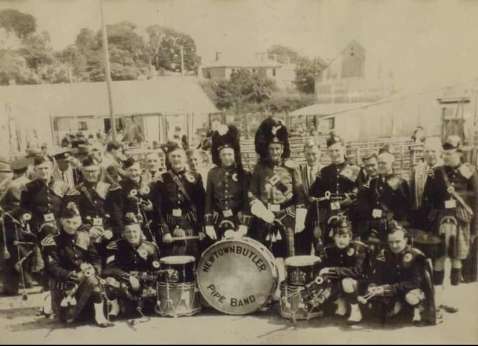 Noble with Newtownbutler Pipe Band at Enniskillen Mart (front row, first on left)