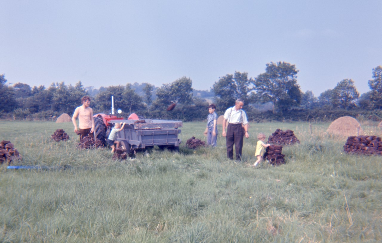 Bringing home ‘clamps’ of turf in the 1970s with family and friends.