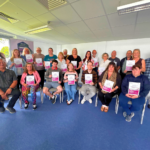 Participants of the PEACEPLUS ‘Investing in Community Volunteers’ Programme receiving certificates after completing Adult Safeguarding Training. The course supports those in safeguarding roles, providing an understanding of responsibilities, reporting procedures, and key issues such as consent, capacity and organisational duties.