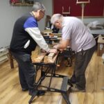 Members of Dromore 2000 Community Group and the local Men's Shed pictured creating window boxes for businesses throughout the town using timber supplied through the PEACEPLUS Environment for All Programme. Fermanagh and Omagh District Council also provided bedding plants for the initiative, with both groups working together to enhance the local environment and promote community pride in Dromore.