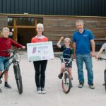 Caitilin Jones, Project Officer, pictured with participants at the Bike Repair Workshop in Carrickmore, delivered by Bikewise. through the PEACEPLUS Environment For All Programme The workshop provided hands-on experience in basic bike maintenance, helping participants gain the skills and confidence needed to keep their bikes safe, reliable, and ready for the road.