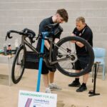 Bradley from Bikewise demonstrates bike maintenance techniques to a participant at the Environment for All Bike Repair Workshop. The session gave participants the opportunity to develop practical maintenance skills and receive expert advice on keeping their bicycles safe, reliable, and ready for the road.